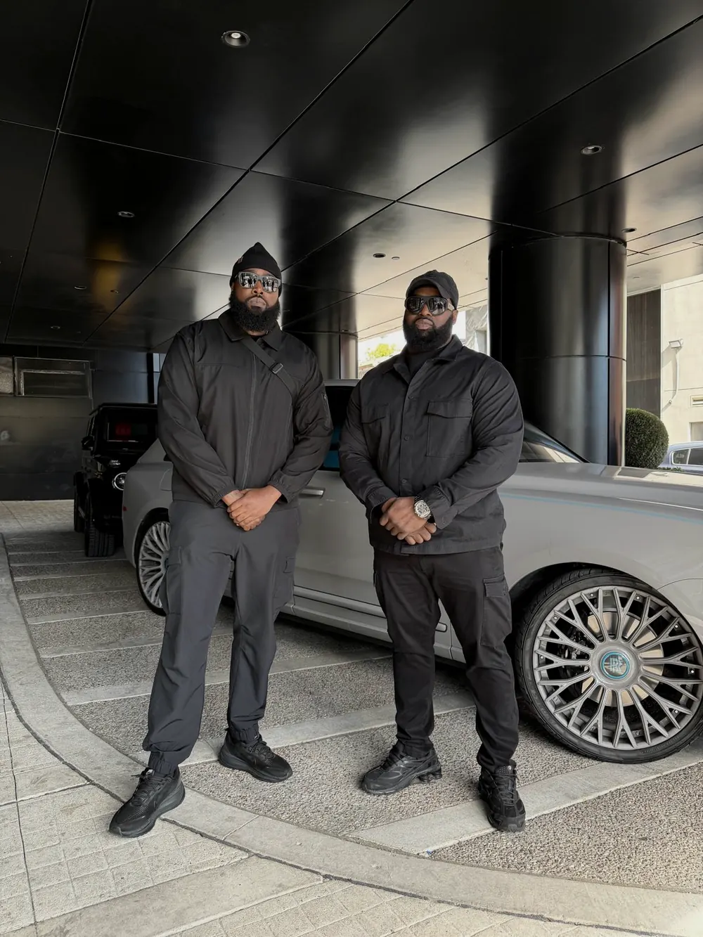 The owners, beside a client’s car.