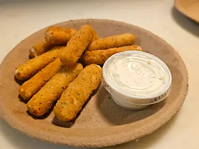 Mozzarella sticks with a cup of ranch